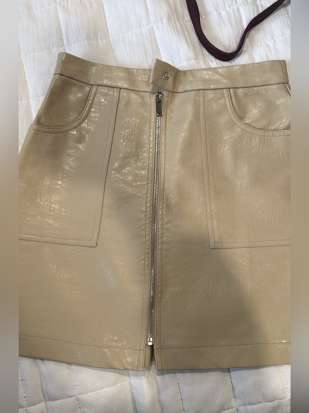 Faux Leather Zip-Front Mini Skirt in Taupe